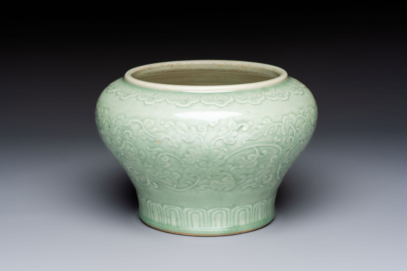 A Chinese celadon-glazed 'Flower Scroll' jar, Qianlong (1 of 7)