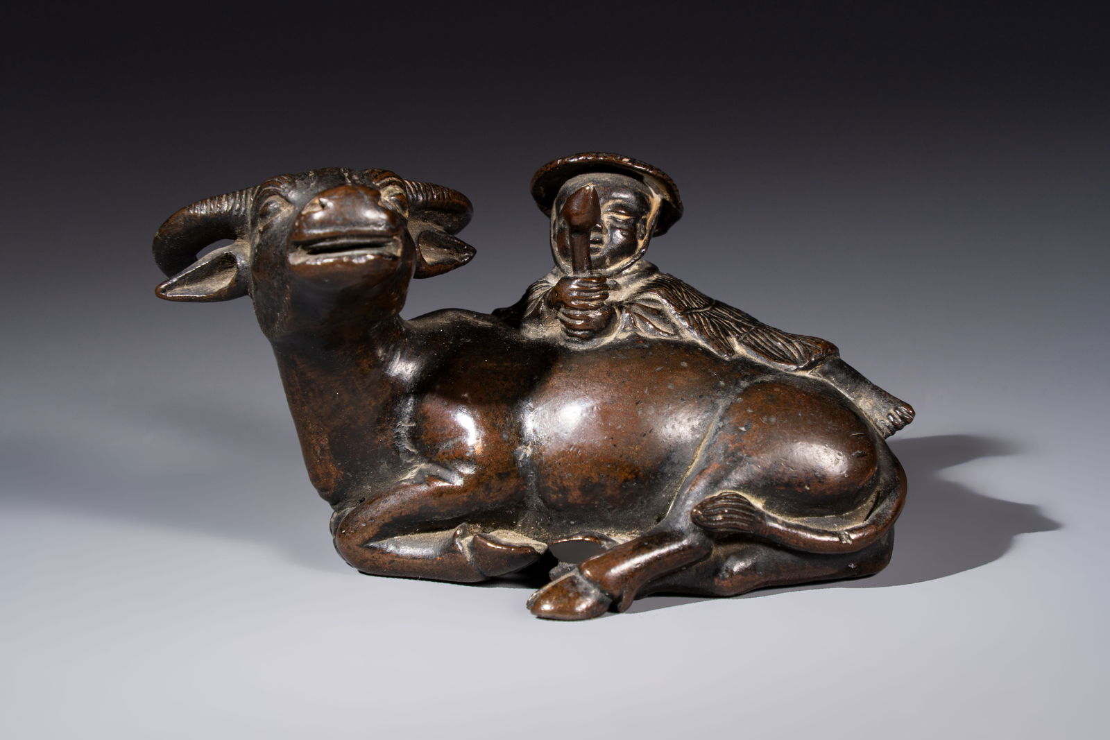 A Chinese bronze 'Boy and Buffalo' paperweight, Ming (1 of 6)