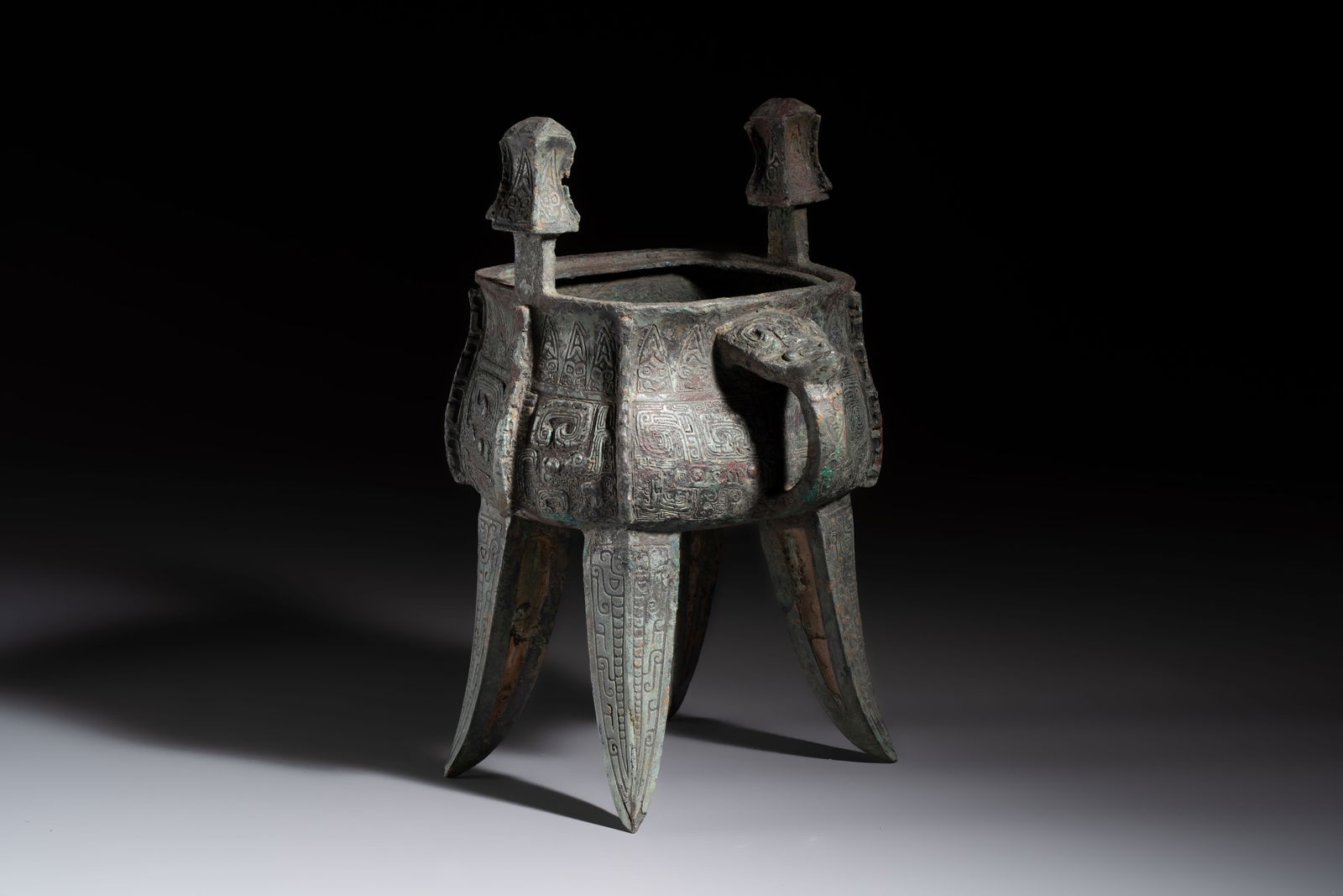 A Chinese archaic bronze wine vessel with owl design, Jia, late Shang (1 of 7)