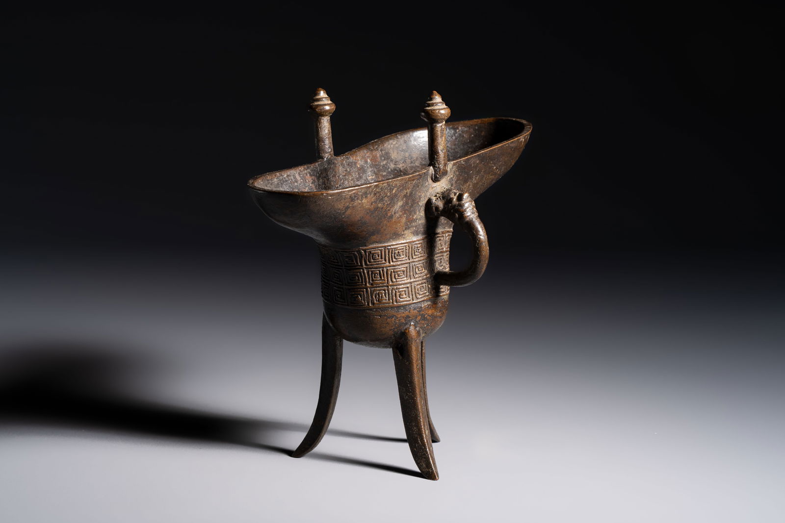 A Chinese archaistic bronze ritual wine vessel, Jue, Qianlong mark, dated 1738 (1 of 8)