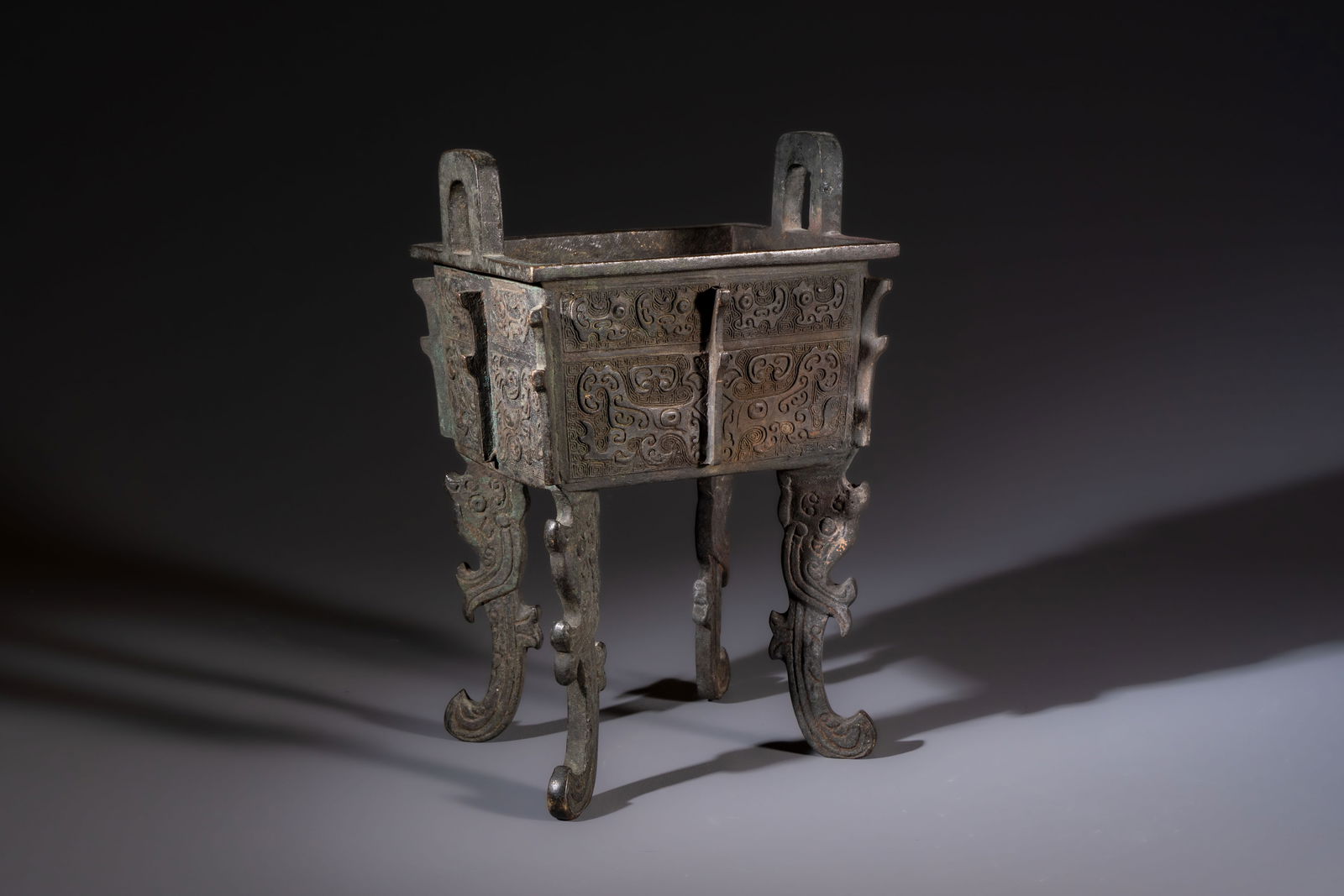 A Chinese archaistic bronze censer with Taotie design, Fang Ding, Ming (1 of 7)