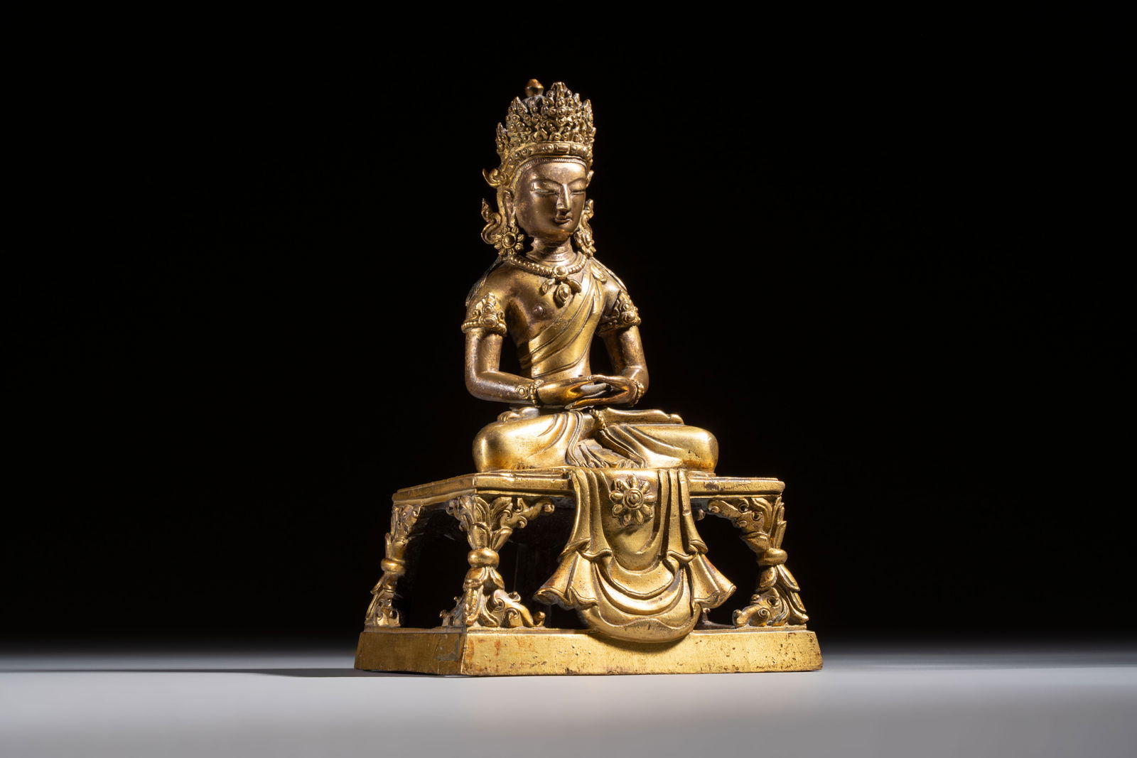 A Sino-Tibetan gilt-bronze figure of Buddha Amitayus, inscribed, Qianlong: A Sino-Tibetan gilt-bronze figure of Buddha Amitayus, inscribed, Qianlong H.: 18,3 cm Weight: 1410 grams