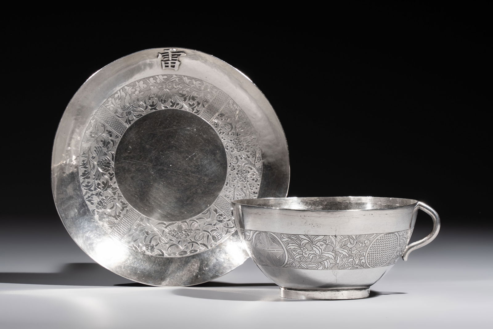 A fine Vietnamese silver saucer and handled bowl, Lei mark, 19th C. (1 of 9)