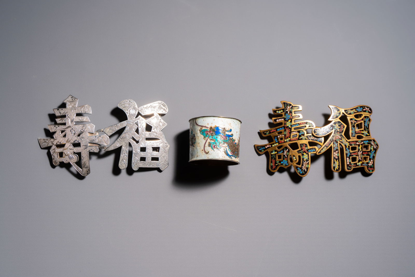A Chinese enamelled silver 'Dragon' napkin ring, a pair of silver buckles and a pair of cloisonné (1 of 9)
