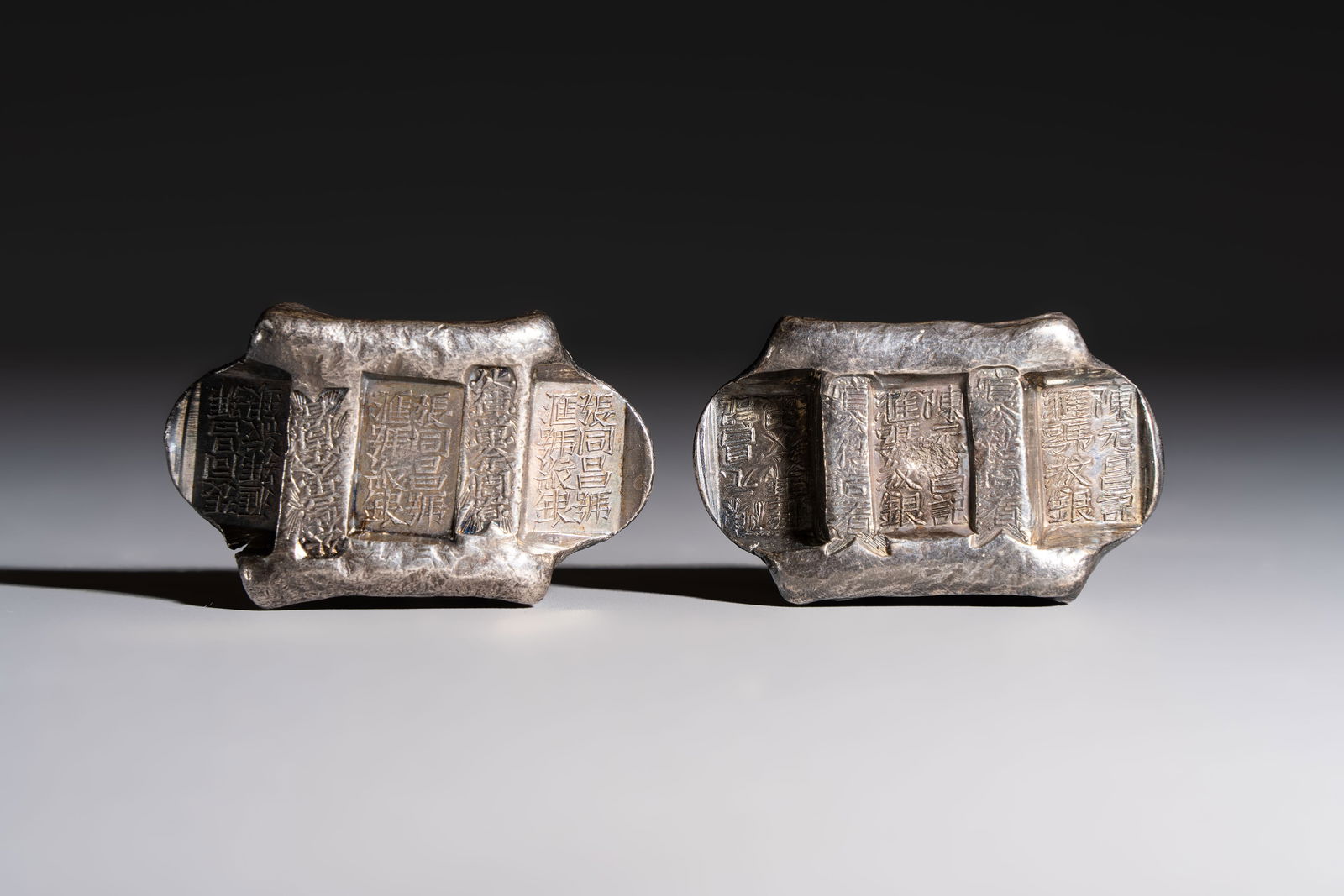 Two Chinese silver "Pai Fang" sycee ingots, Yunnan mint, Zhang Tongchang and Chen Yuanchang marks, (1 of 4)