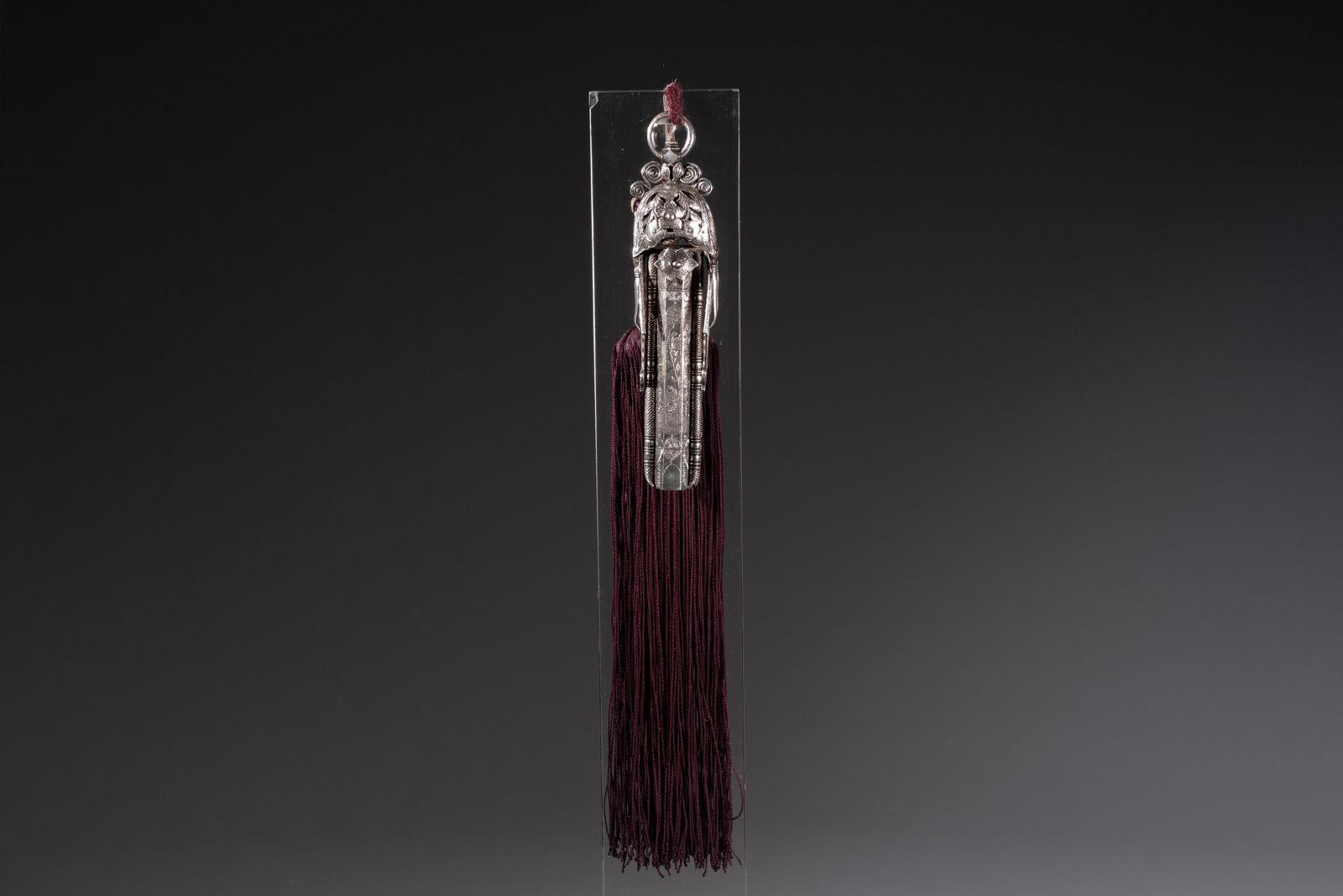 A fine Chinese silver pendant with inscriptions on a plexiglas stand, 19th C. (1 of 9)