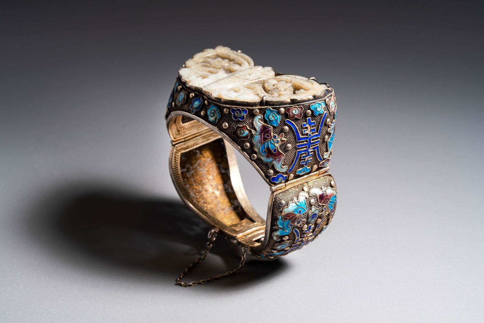 A Chinese jade-inset enamelled silver 'Butterfly' bracelet, 20th C. (1 of 5)