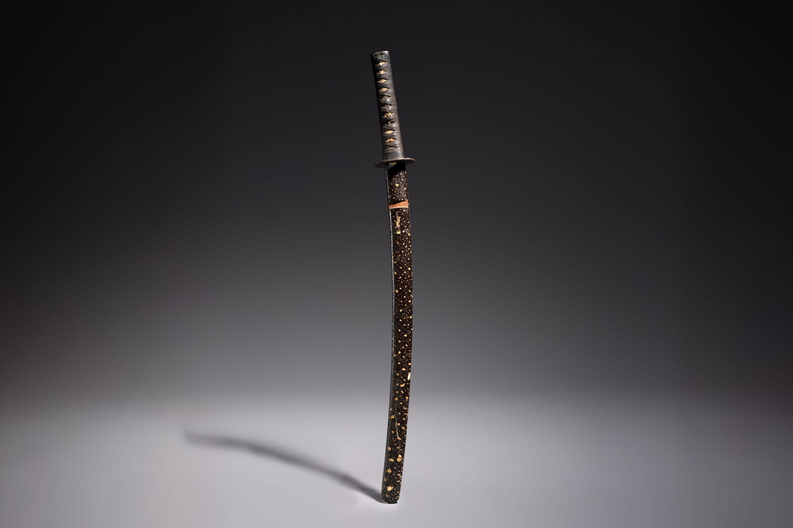 A Japanese katana with a lacquered scabbard and koshirae, Meiji, 19th C. (1 of 7)