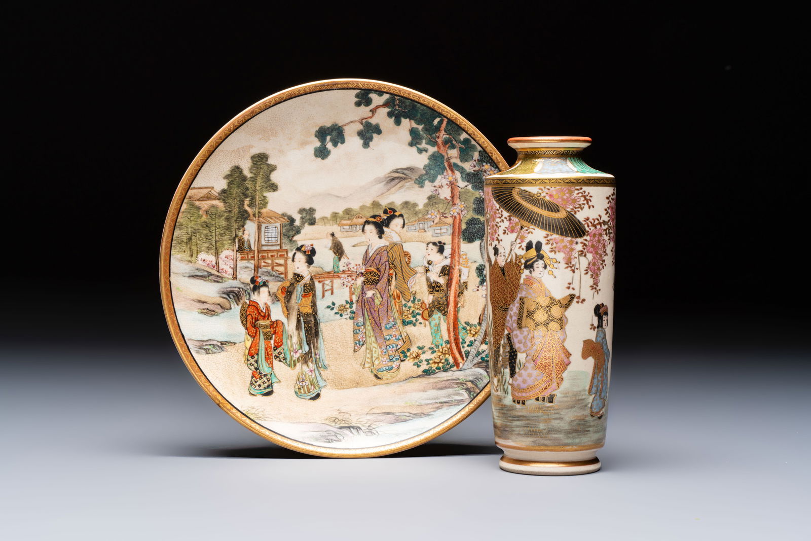A Japanese Satsuma plate and a vase with figural design, Kozan and Ryokuzan mark, Meiji, 19th C. (1 of 9)