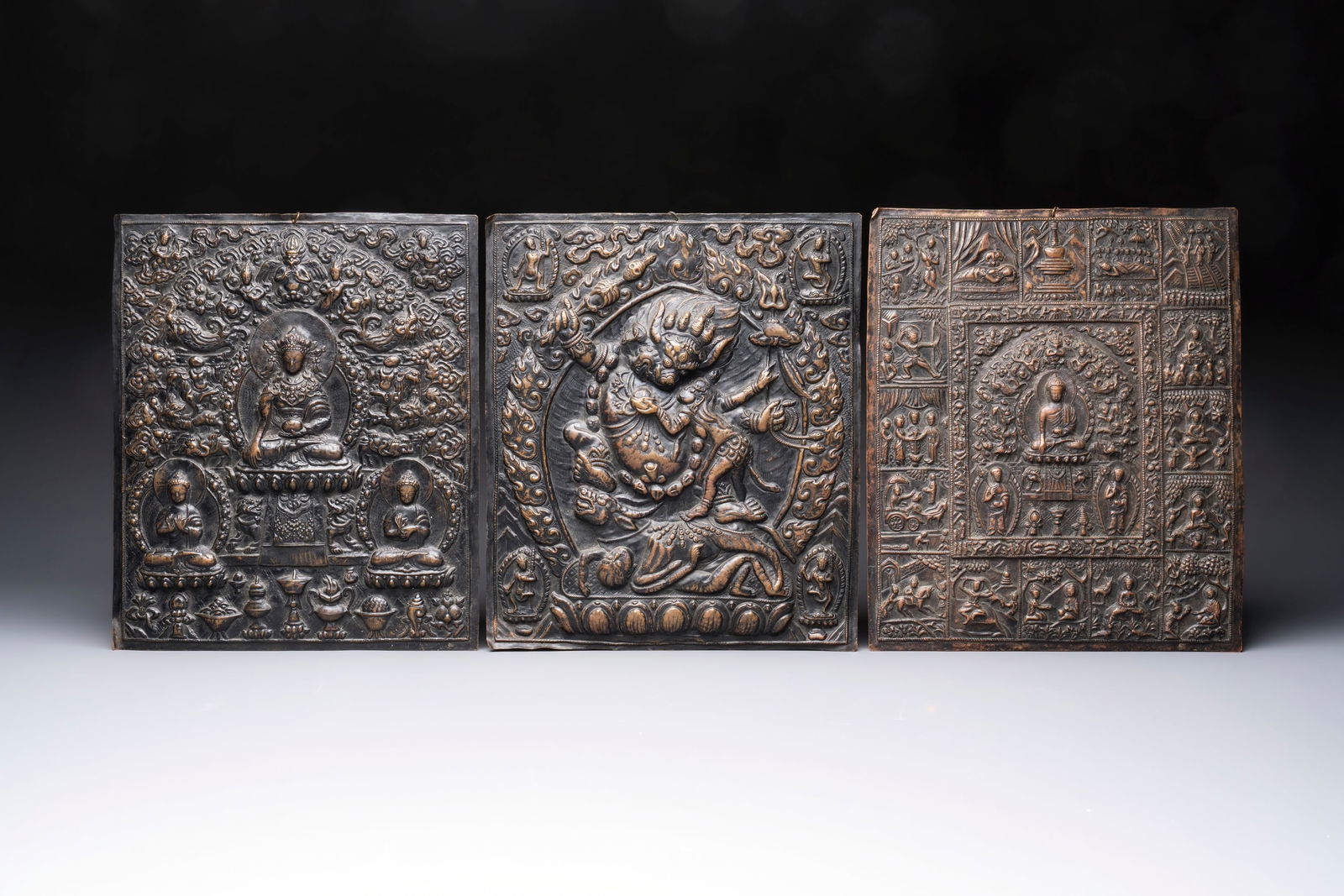 Three Tibetan copper repoussé plaques with Buddhist subjects, 19th C. (1 of 2)