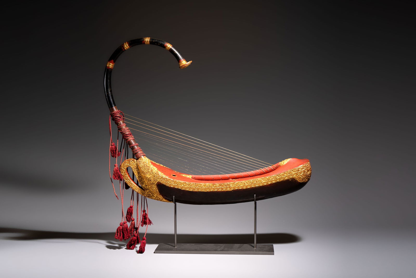A Burmese gilt-lacquered arched harp or saung-gauk, 19/20th C. (1 of 7)