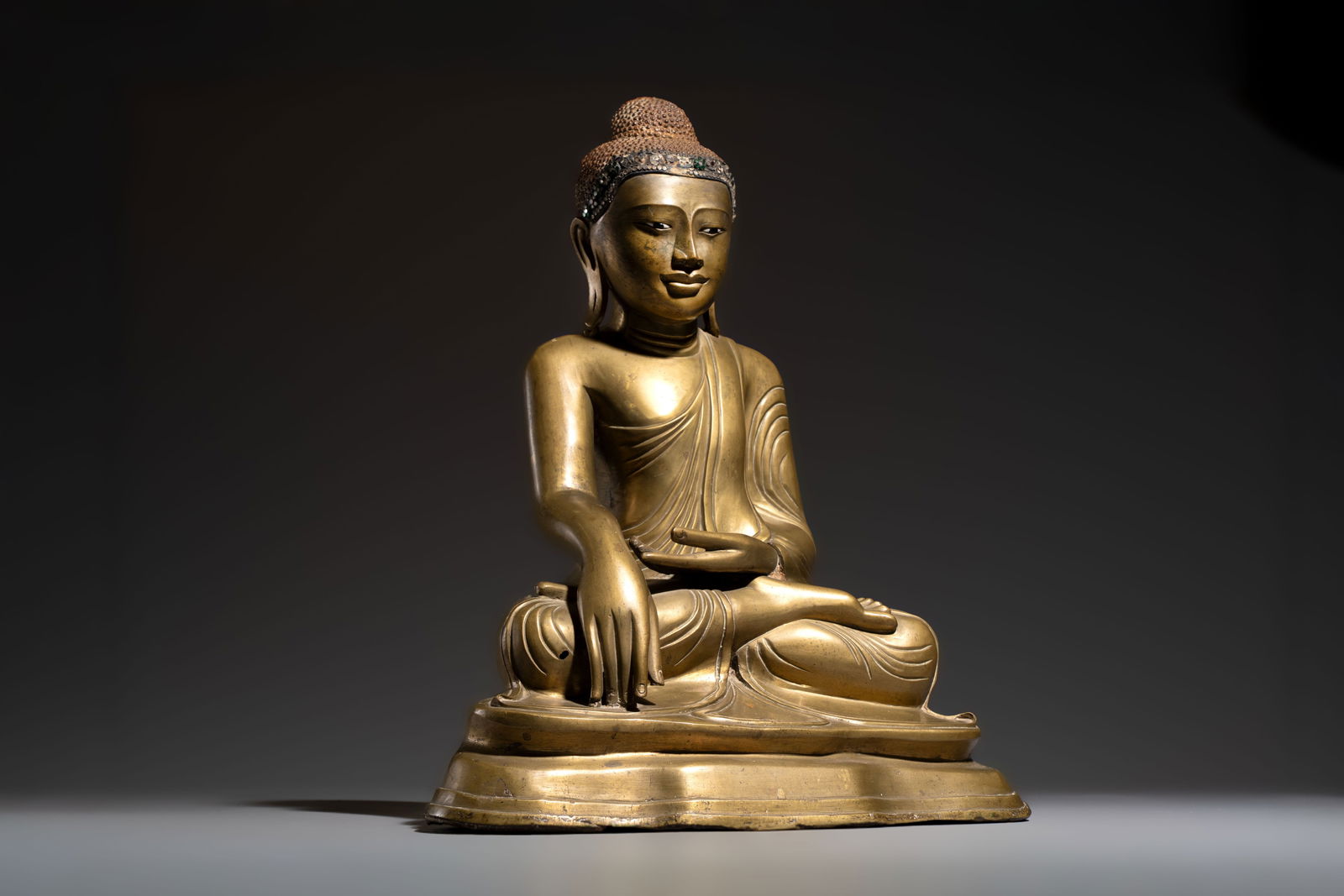 A Burmese partly lacquered bronze Mandalay Buddha, 19/20th C. (1 of 7)