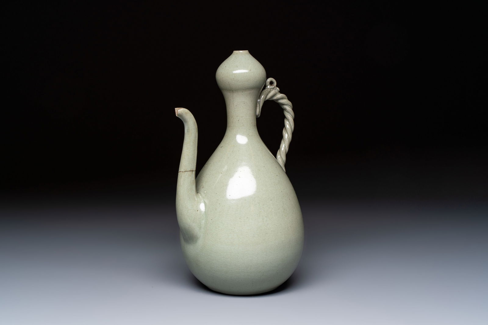 A Korean celadon-glazed ewer with twisted handle, 20th C. (1 of 7)