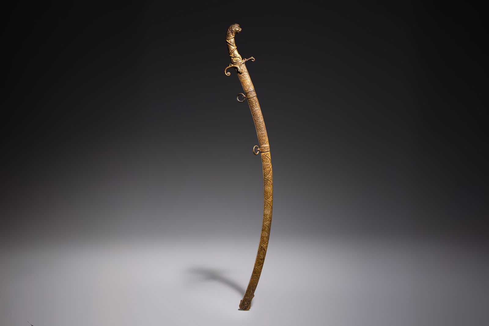 An Austrian gilt court sabre with Nemean lion-head hilt, signed Fischer, 19th C.: An Austrian gilt court sabre with Nemean lion-head hilt, signed Fischer, 19th C. L.: 101,5 cm