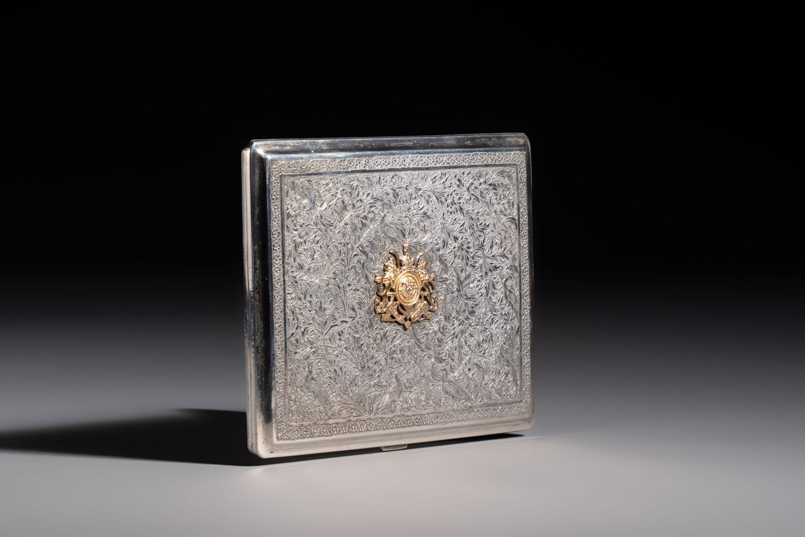 An Iranian silver and gilt cigarette case commemorating Mohammad Reza Pahlavi's coronation, 20th C. (1 of 6)