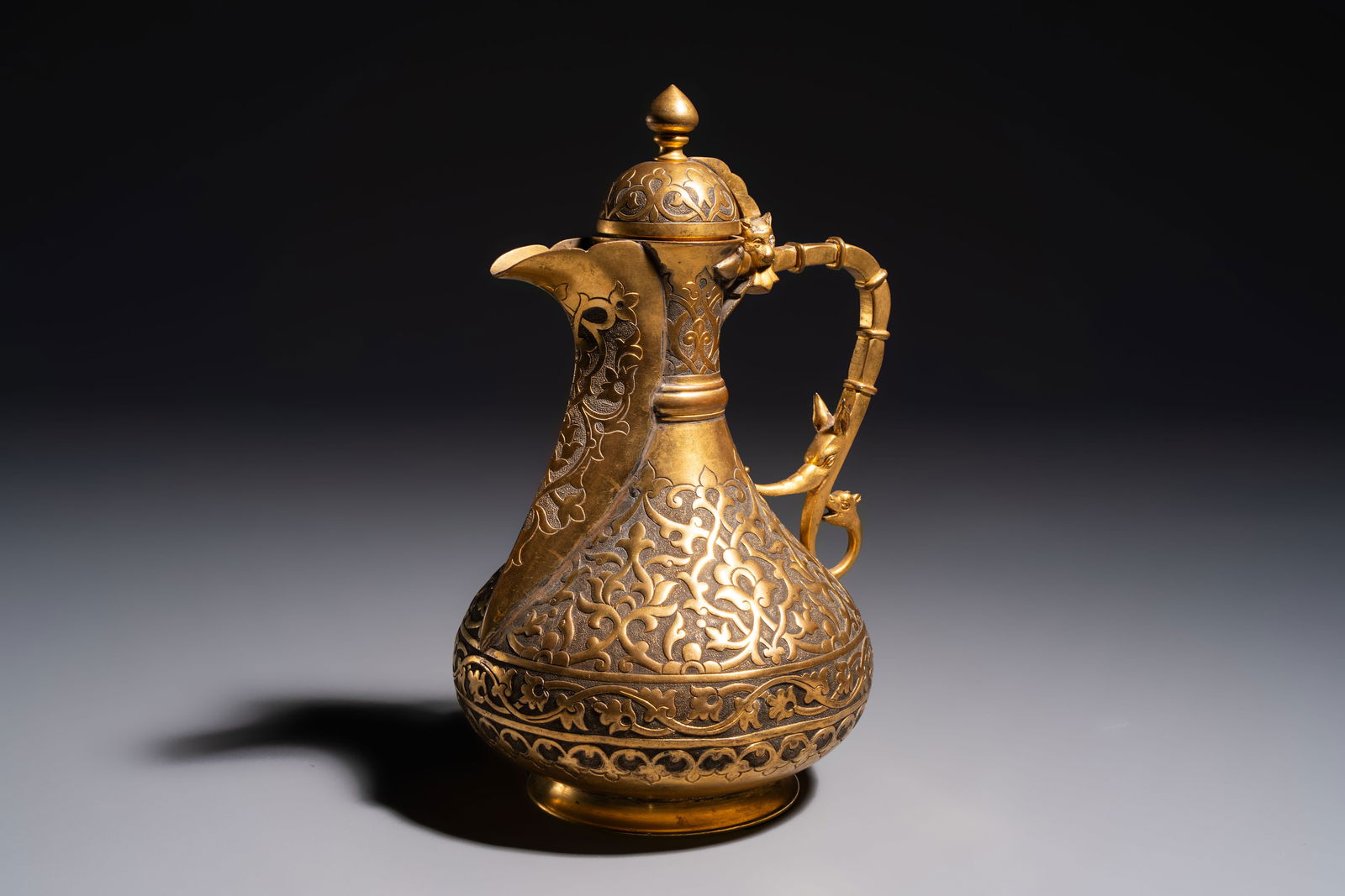 An Ottoman gilt-metal jug with stylised floral design, 19/20th C. (1 of 8)