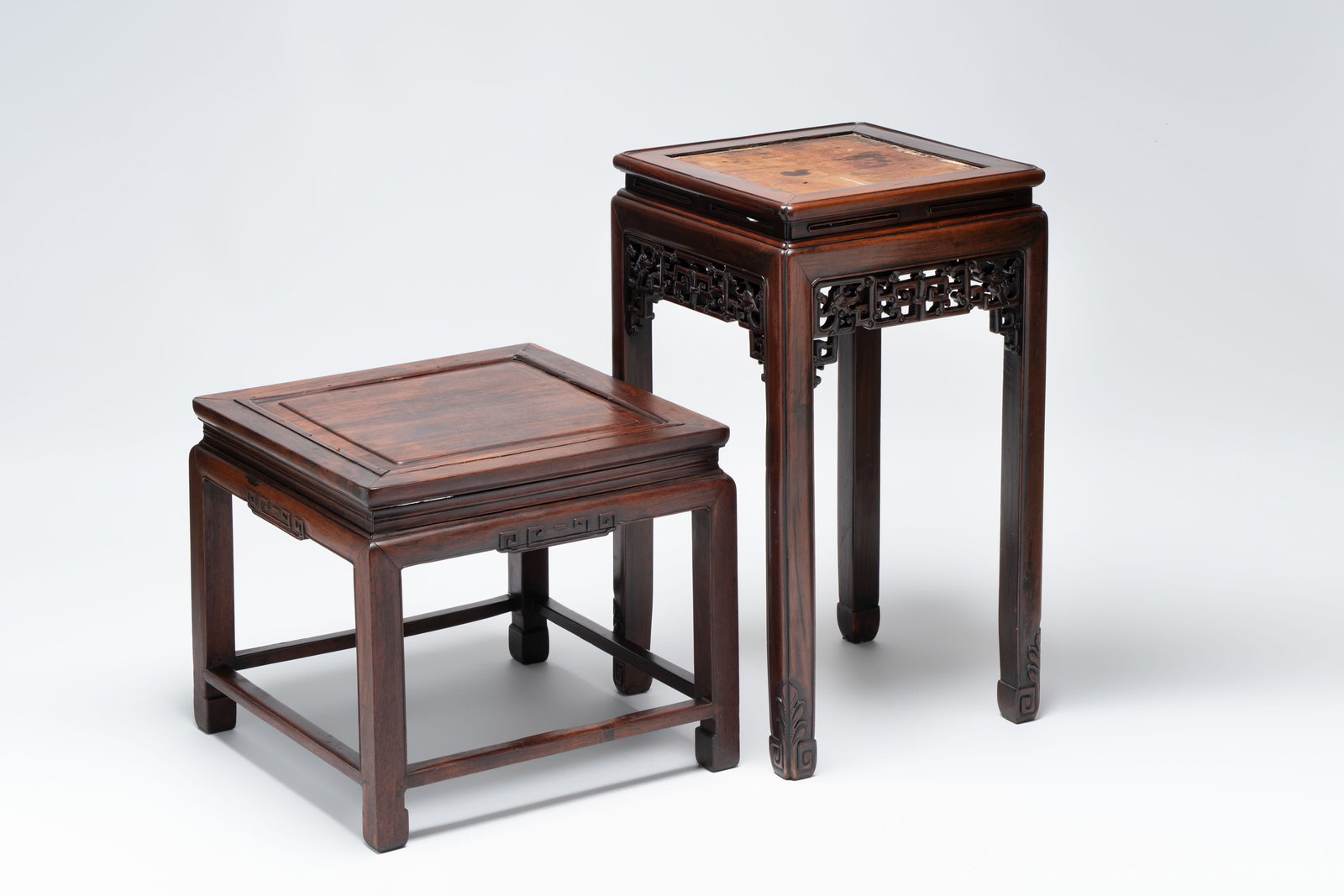 A Chinese hongmu stand and a square low table, 19th C. (1 of 14)