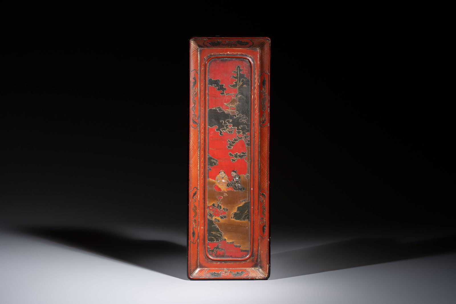 A mother-of-pearl-inlaid gilt-lacquered rectangular tray decorated with two sages in a landscape, (1 of 2)