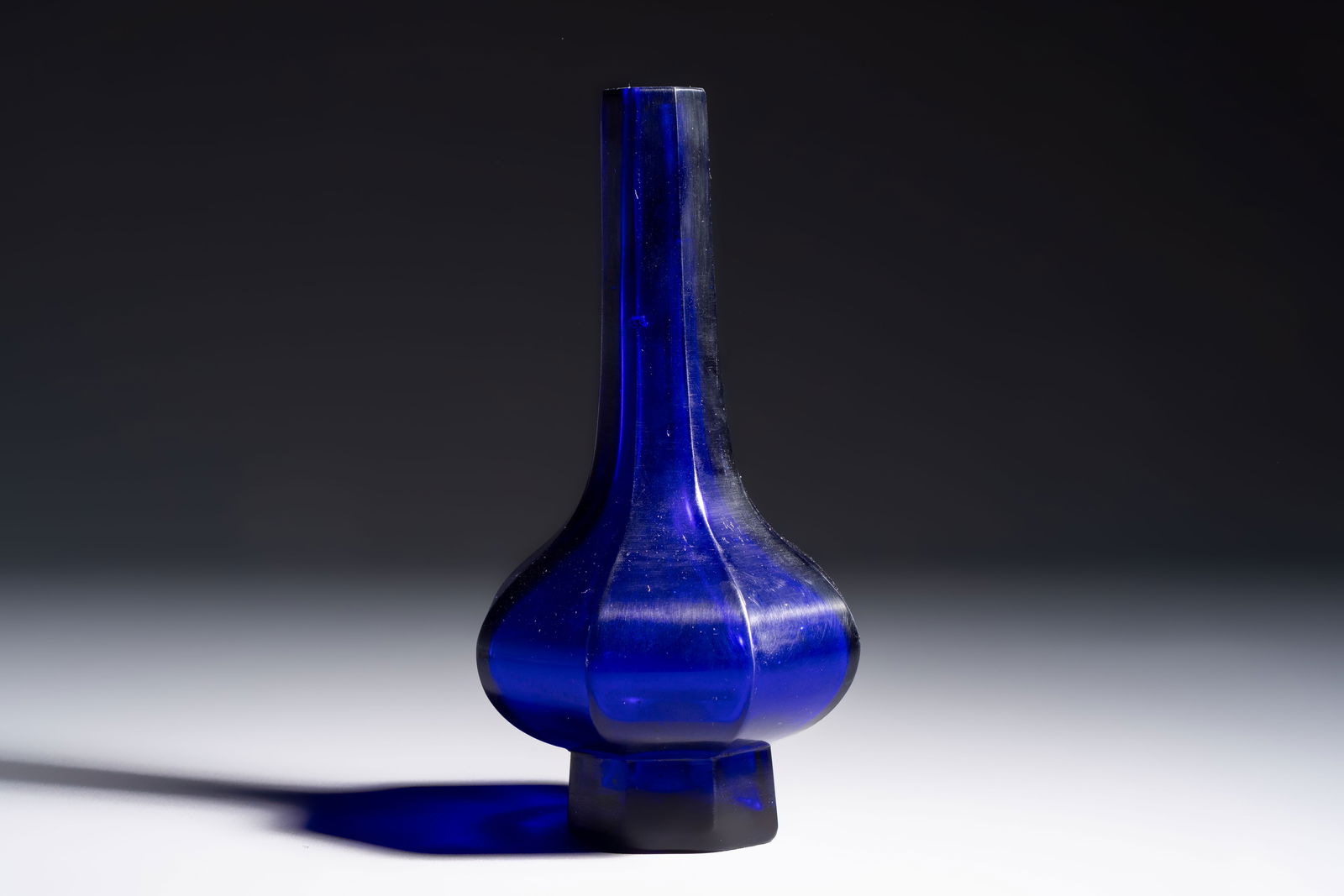 A Chinese blue Beijing glass octagonal bottle vase, Qianlong mark, Republic (1 of 6)