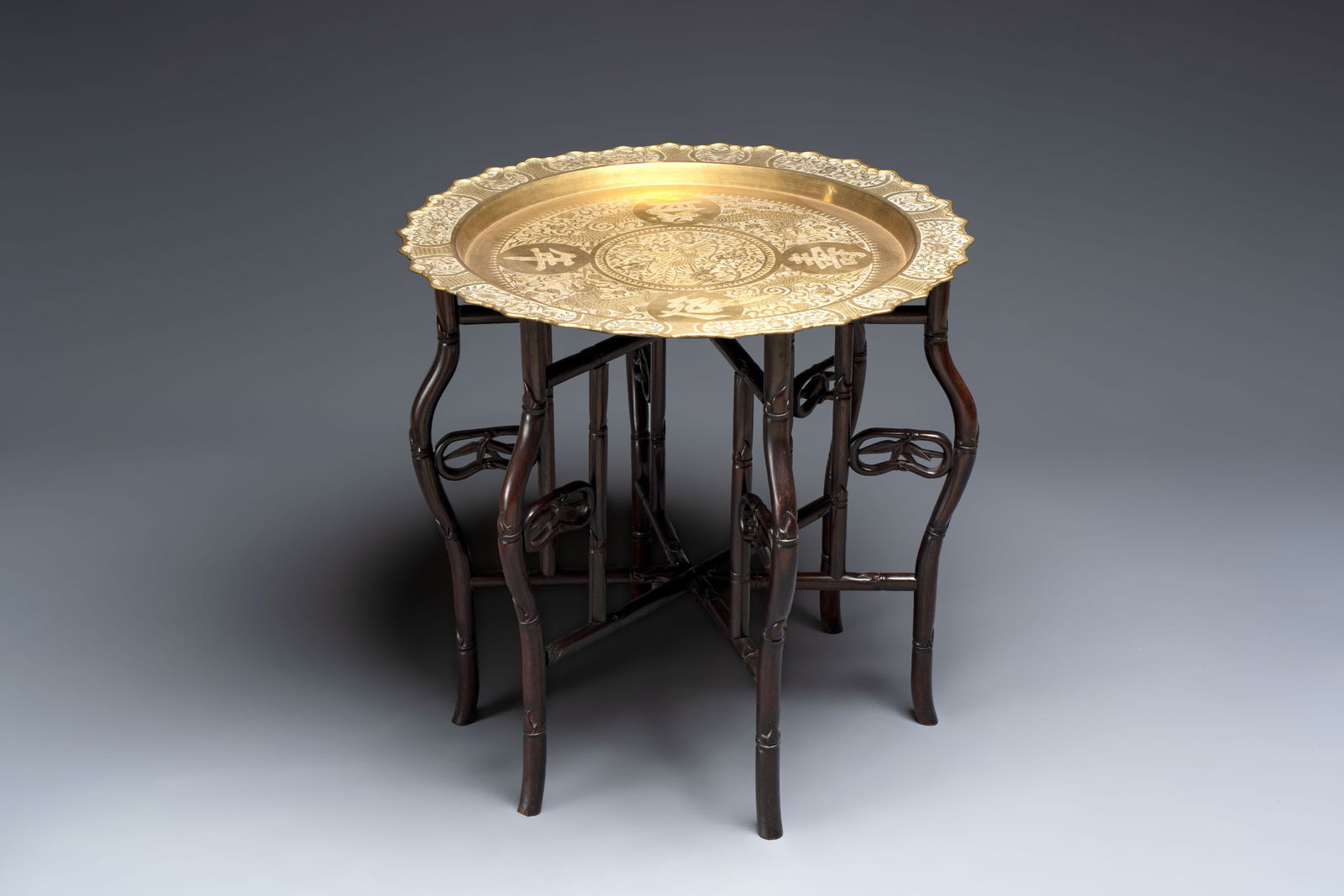 A Chinese brass and hongmu 'Yan Nian Yi Shou' folding table, 19/20th C. (1 of 5)