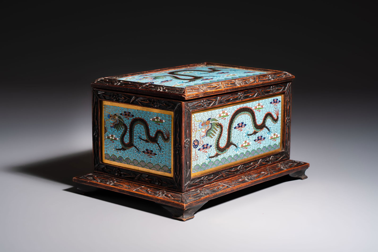 A Chinese wooden 'Dragon' casket mounted with cloisonné plaques, 19/20th C. (1 of 9)