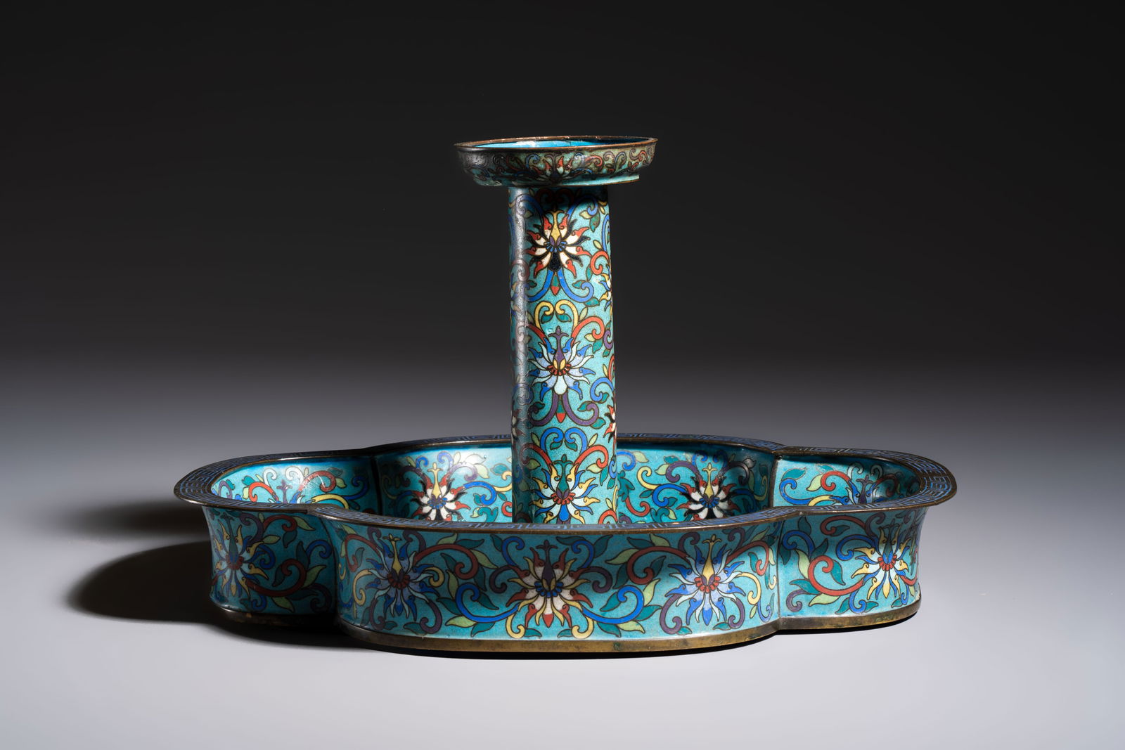 A Chinese cloisonné candleholder with quatrefoil base, 19/20th C. (1 of 7)