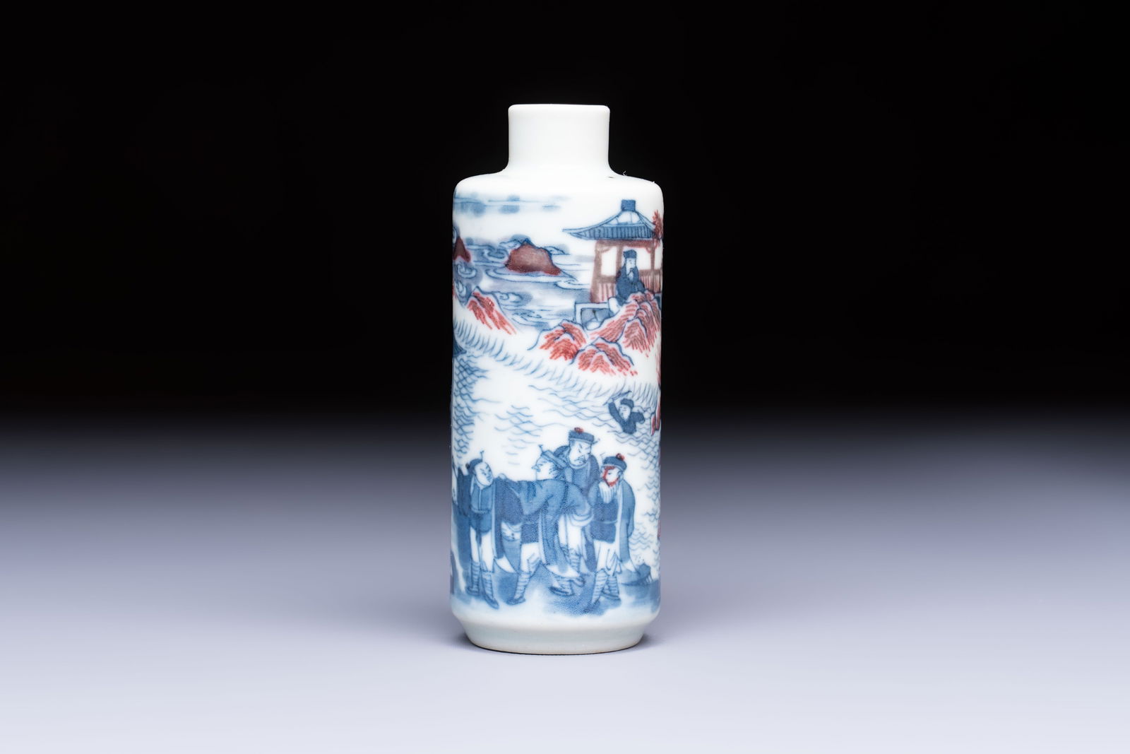 A fine Chinese blue, white and copper-red snuff bottle with narrative design, 19th C. (1 of 6)