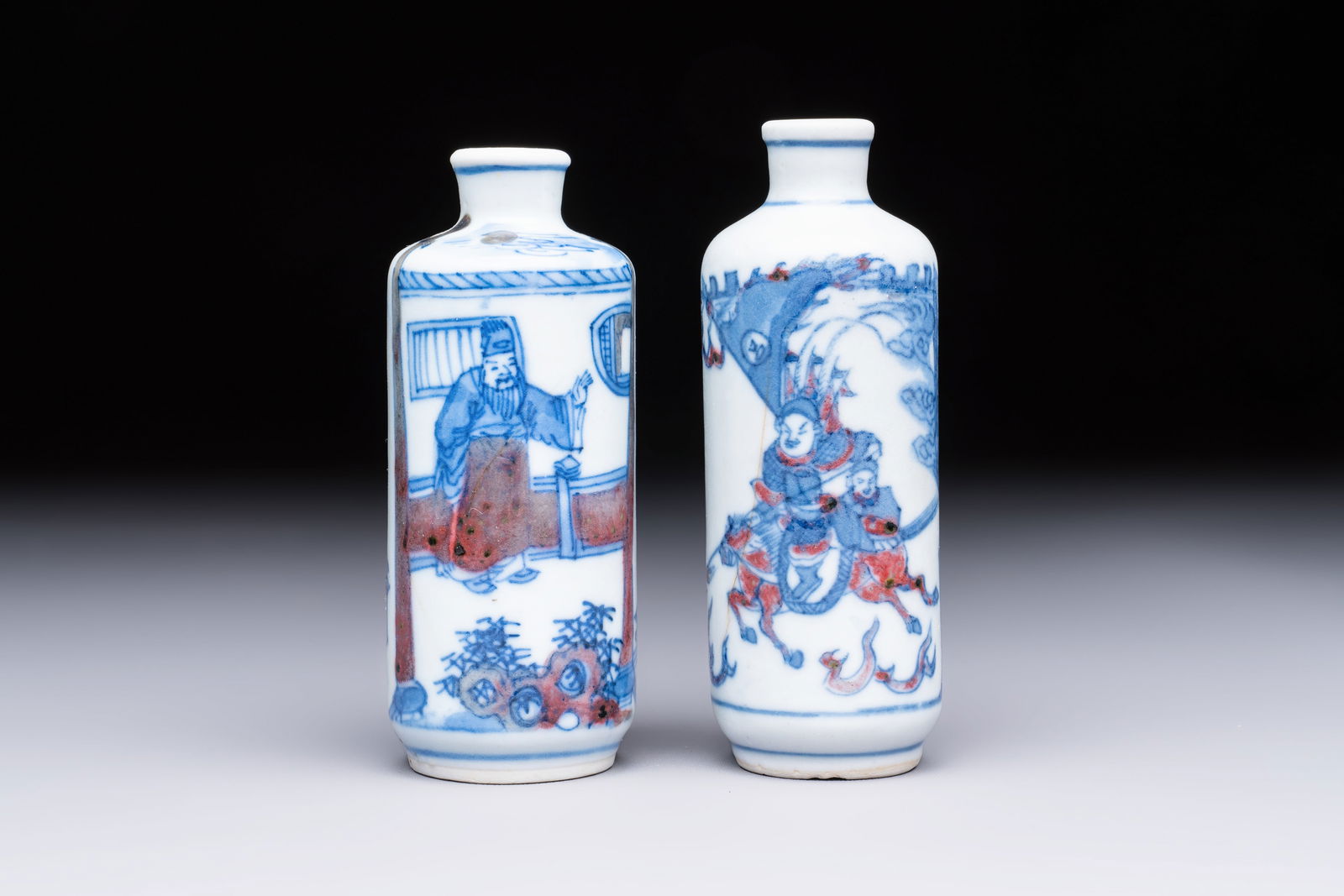 Two Chinese blue, white and copper-red snuff bottles with narrative design, 19th C. (1 of 6)