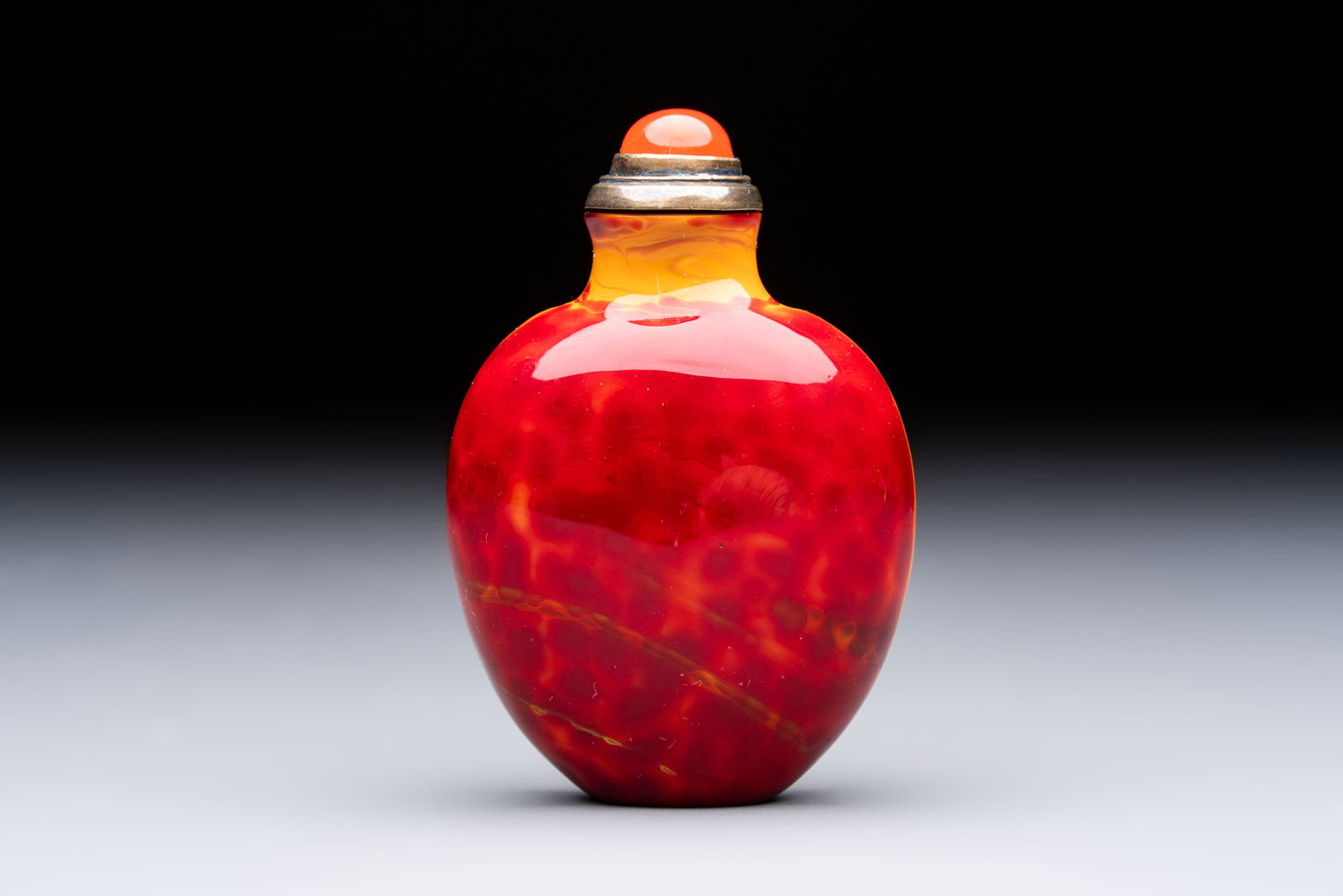 A Chinese 'Realgar Dragon' glass snuff bottle, probably from the imperial Beijing glass workshop, (1 of 9)