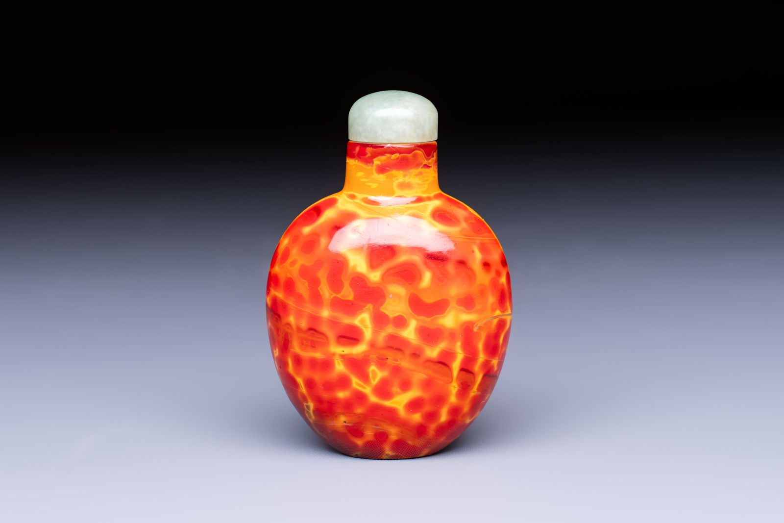 A Chinese 'Realgar' glass snuff bottle, 19th C. (1 of 6)