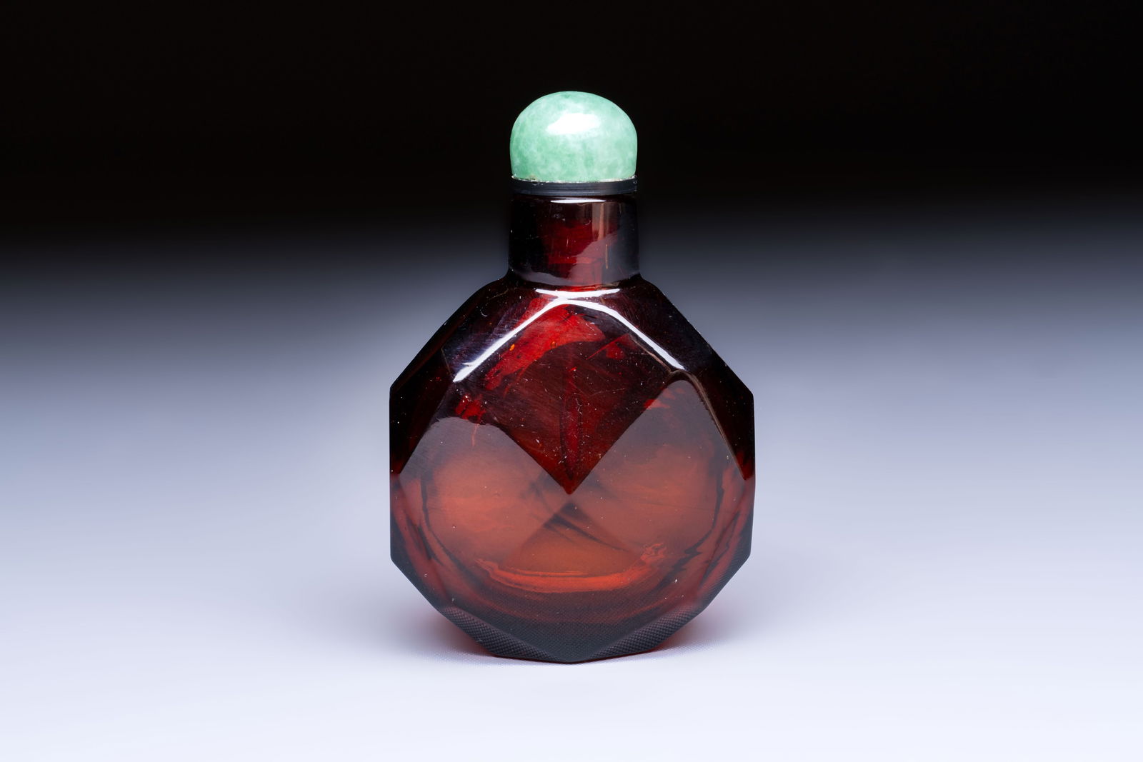 A Chinese facetted amber glass snuff bottle, 19th C. (1 of 7)