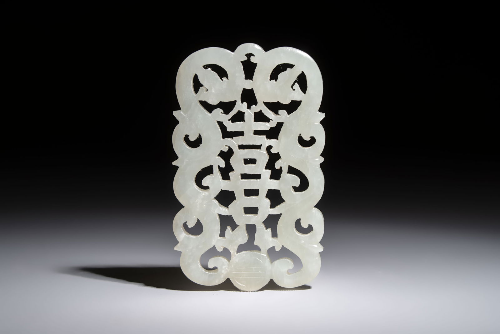 A Chinese white jade plaque, 18/19th C. (1 of 6)