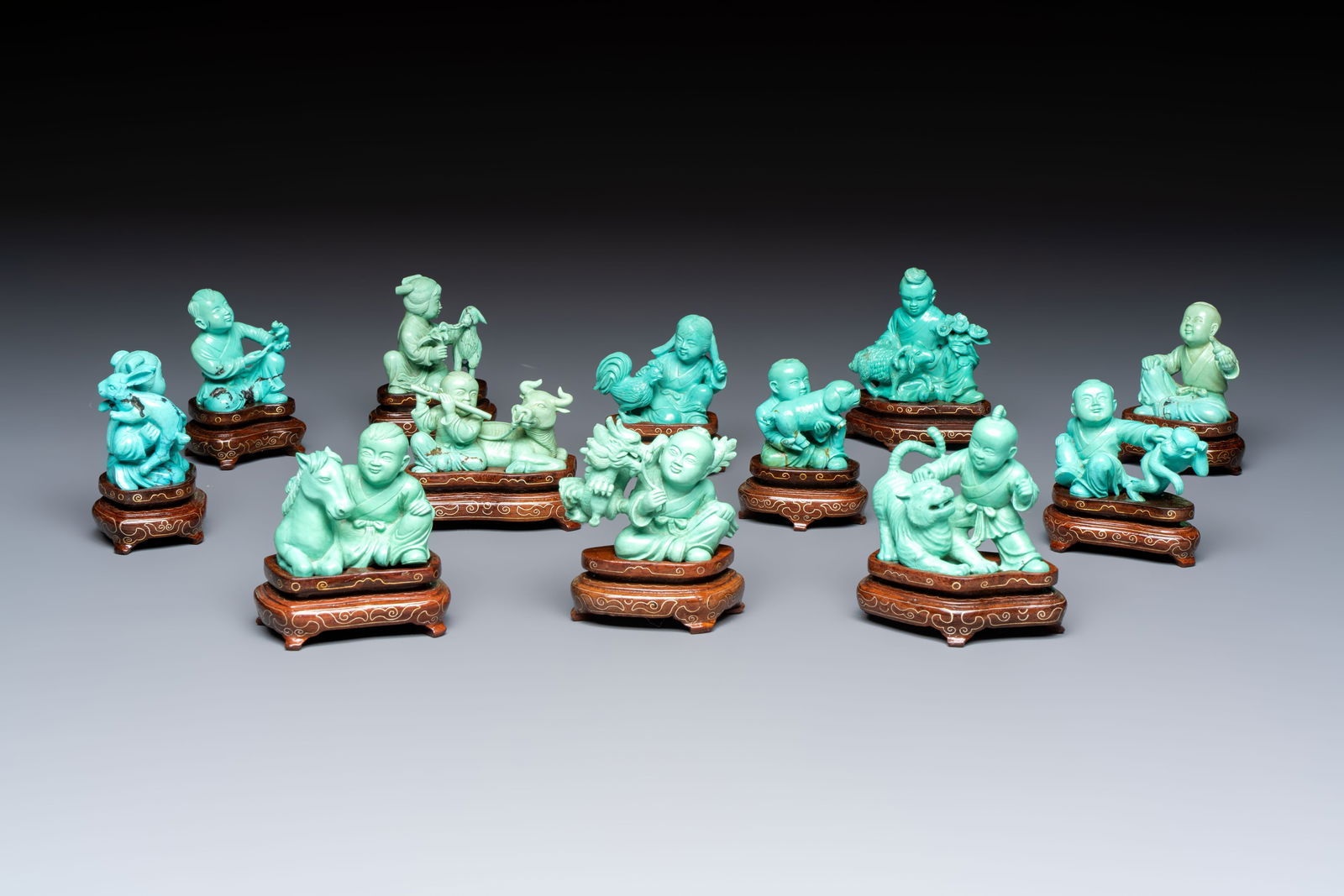 A complete set of 12 Chinese carved turquoise 'Children at Play with the Zodiac Animals' figures on (1 of 13)