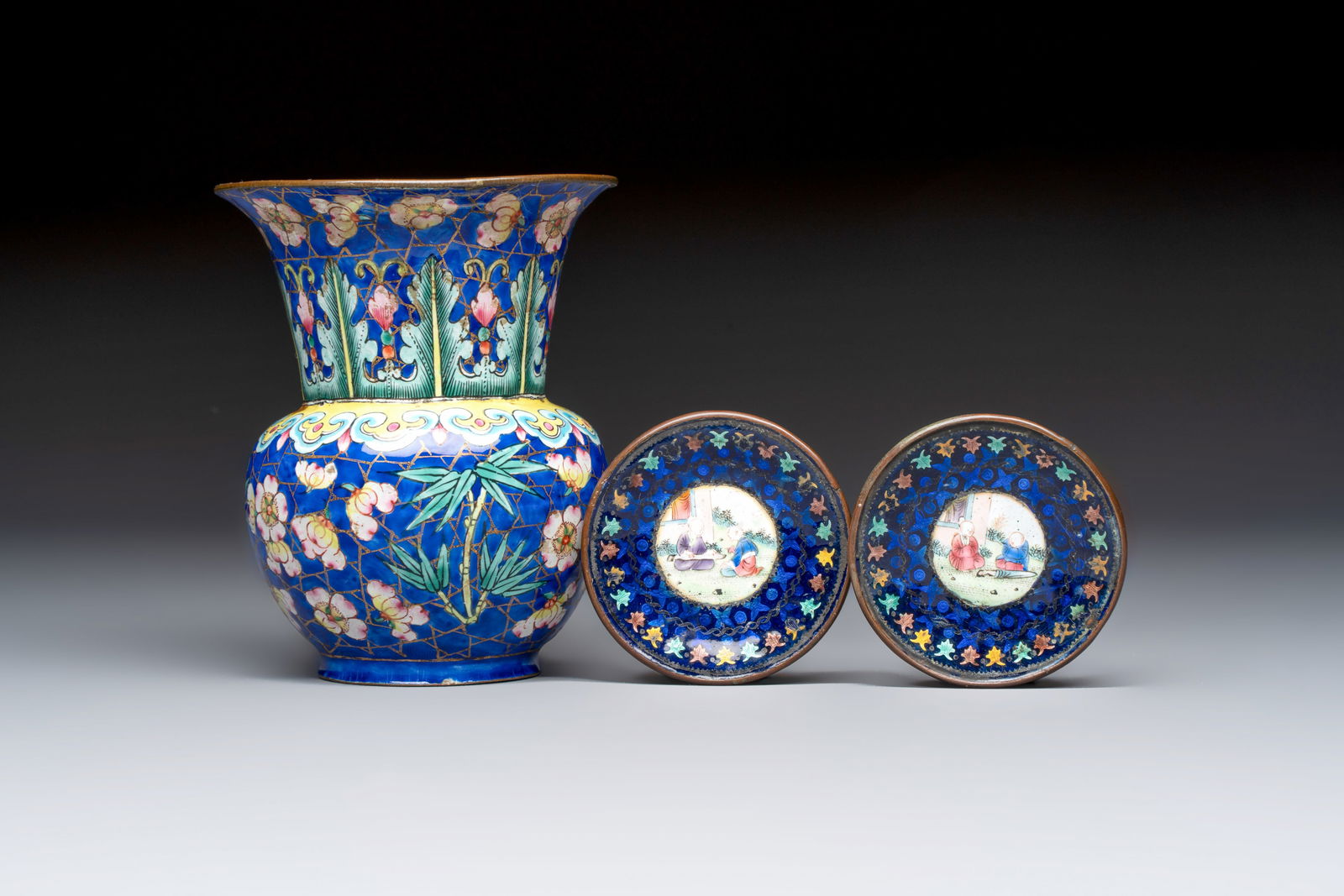 A Chinese Canton enamel 'Prunus on Cracked Ice' spittoon and two snuff dishes, 19th C. (1 of 9)