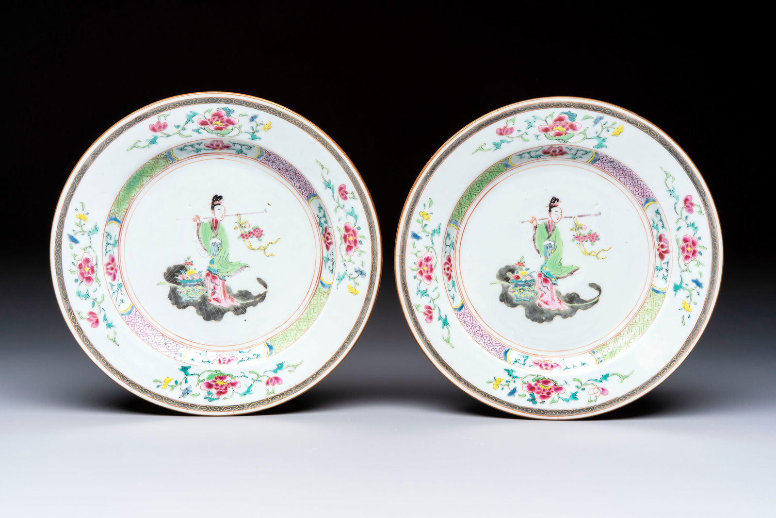 A pair of Chinese famille rose 'Magu' plates, Yongzheng/Qianlong (1 of 2)