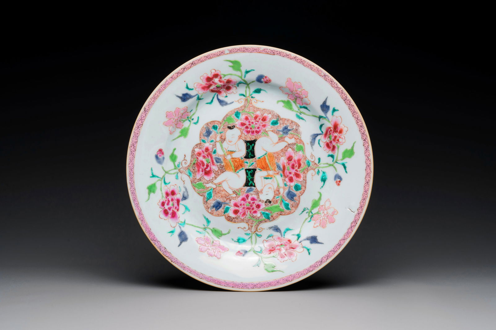 A Chinese famille rose 'He He Er Xian' plate, Yongzheng/Qianlong (1 of 2)