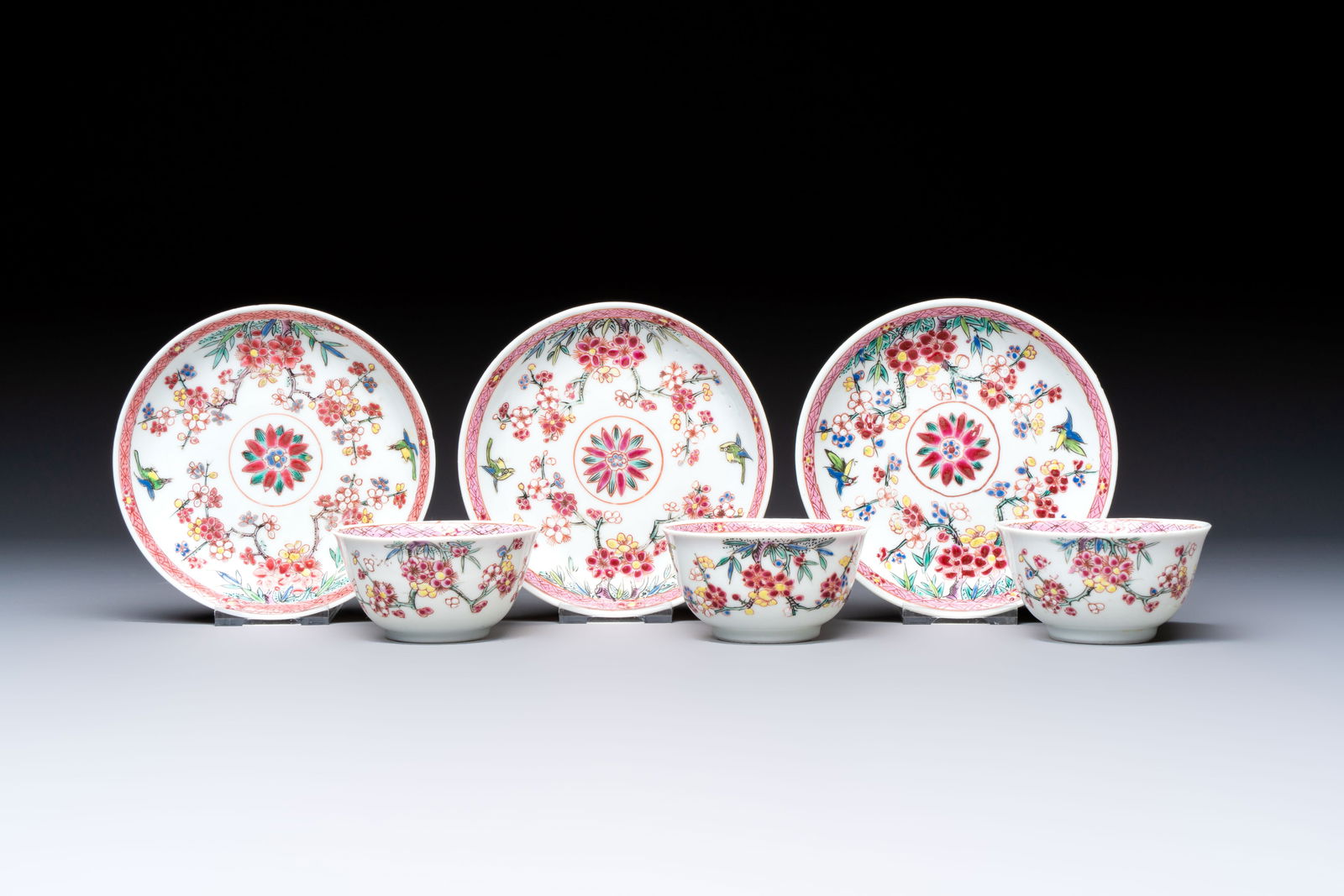 Three Chinese famille rose 'Birds and Plum Trees' cups and saucers, Yongzheng (1 of 9)