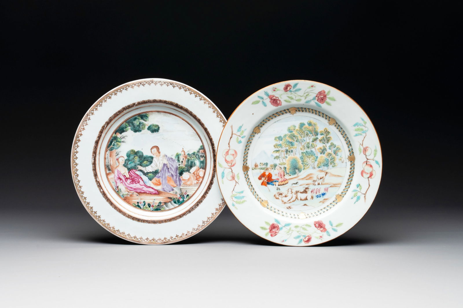 A Chinese famille rose plate depicting a scene from a fable by La Fontaine and a 'Shepherds' plate,: A Chinese famille rose plate depicting a scene from a fable by La Fontaine and a 'Shepherds' plate, Qianlong Dia.: 23,5 cm (the largest) Dia.: 23 cm (the smallest)