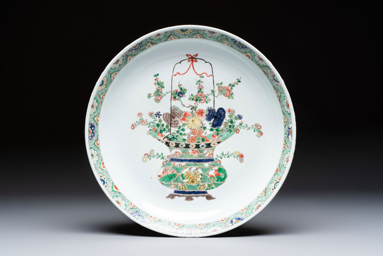 A Chinese famille verte 'Flower Basket' dish, lozenge mark, Kangxi (1 of 2)