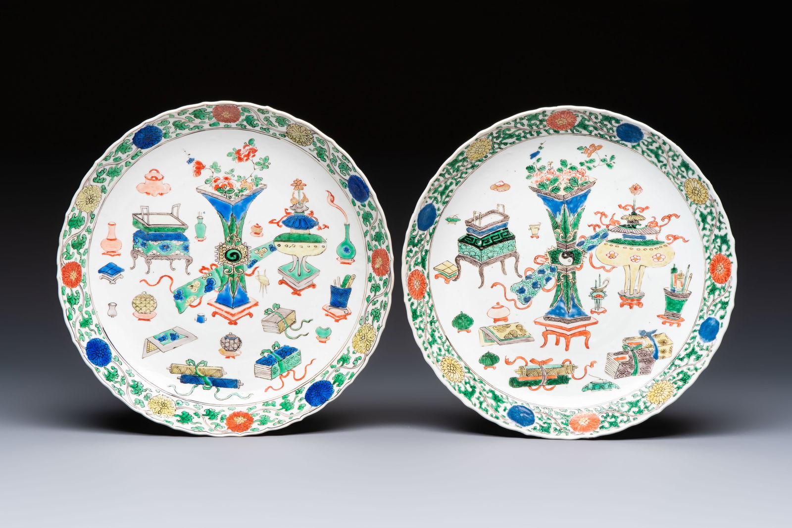 A pair of Chinese famille verte 'Antiquities' dishes, Kangxi (1 of 2)