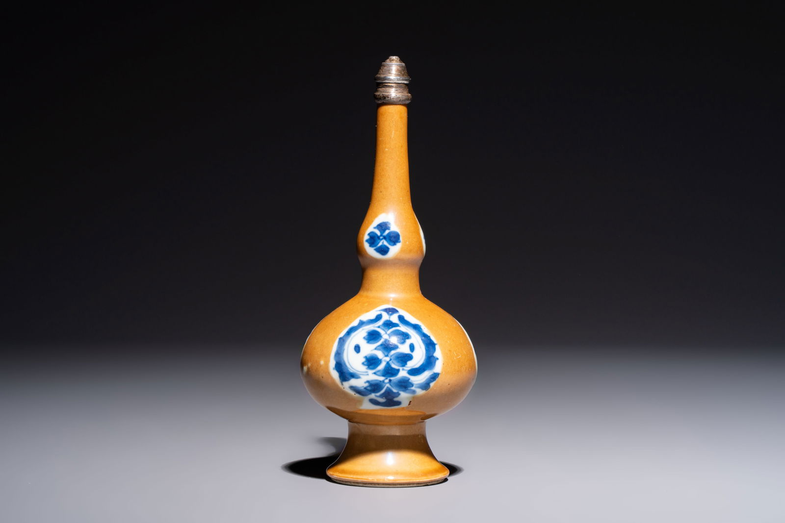 A Chinese blue and white capucine-ground rosewater sprinkler with silver mount, Kangxi (1 of 6)