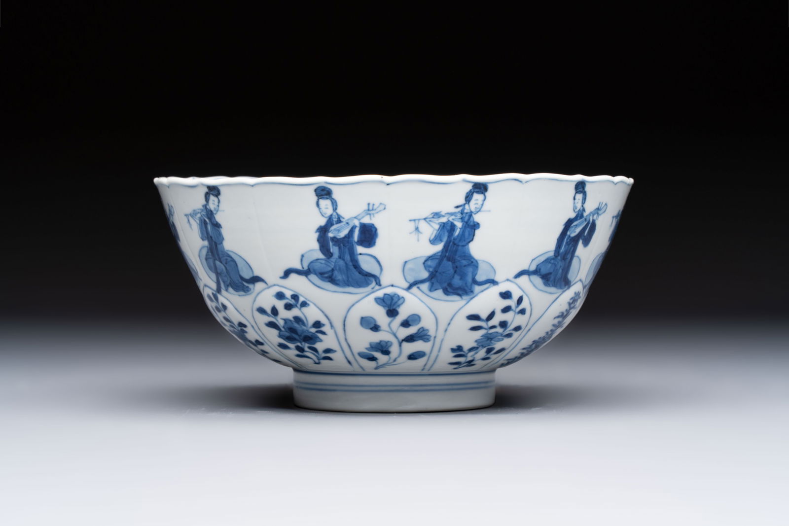 A Chinese blue and white moulded 'Elegant Beauties' bowl, Chenghua mark, Kangxi (1 of 6)