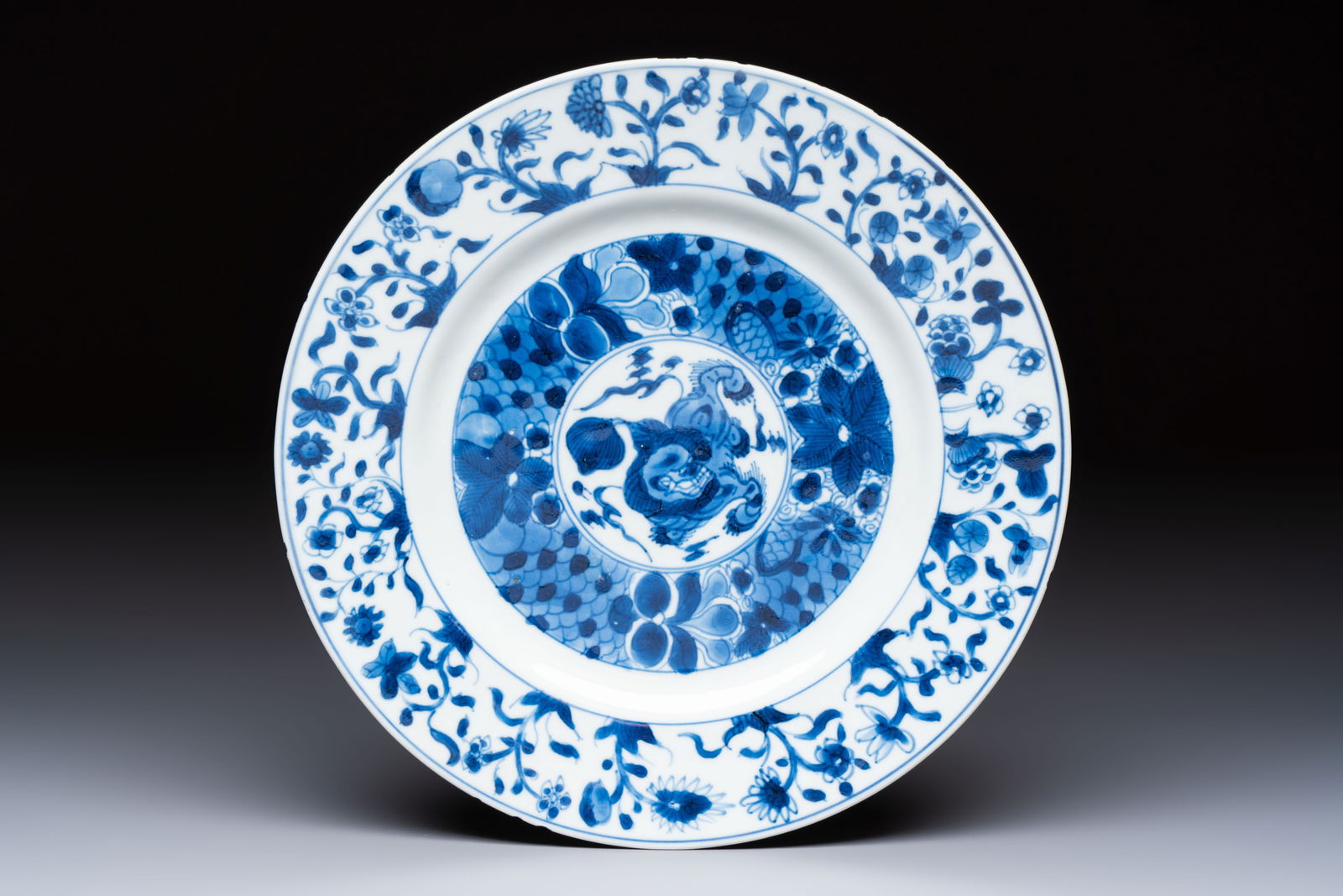 A Chinese blue and white 'Buddhist Lion' plate, Kangxi (1 of 2)