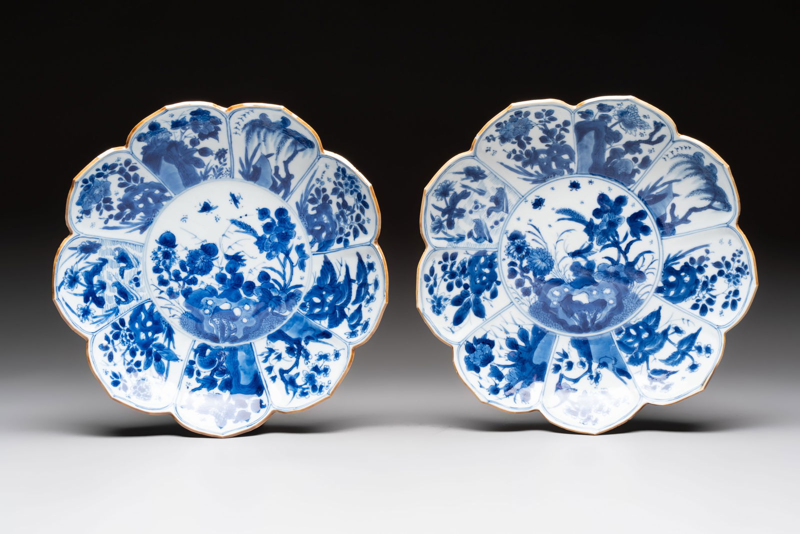 A pair of Chinese blue and white lotus-form 'Grasshopper' plates, Kangxi (1 of 2)