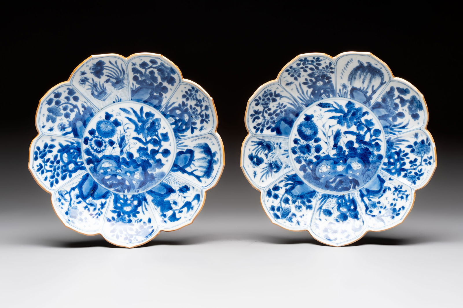 A pair of Chinese blue and white lotus-form 'Grasshopper' plates, Kangxi (1 of 2)