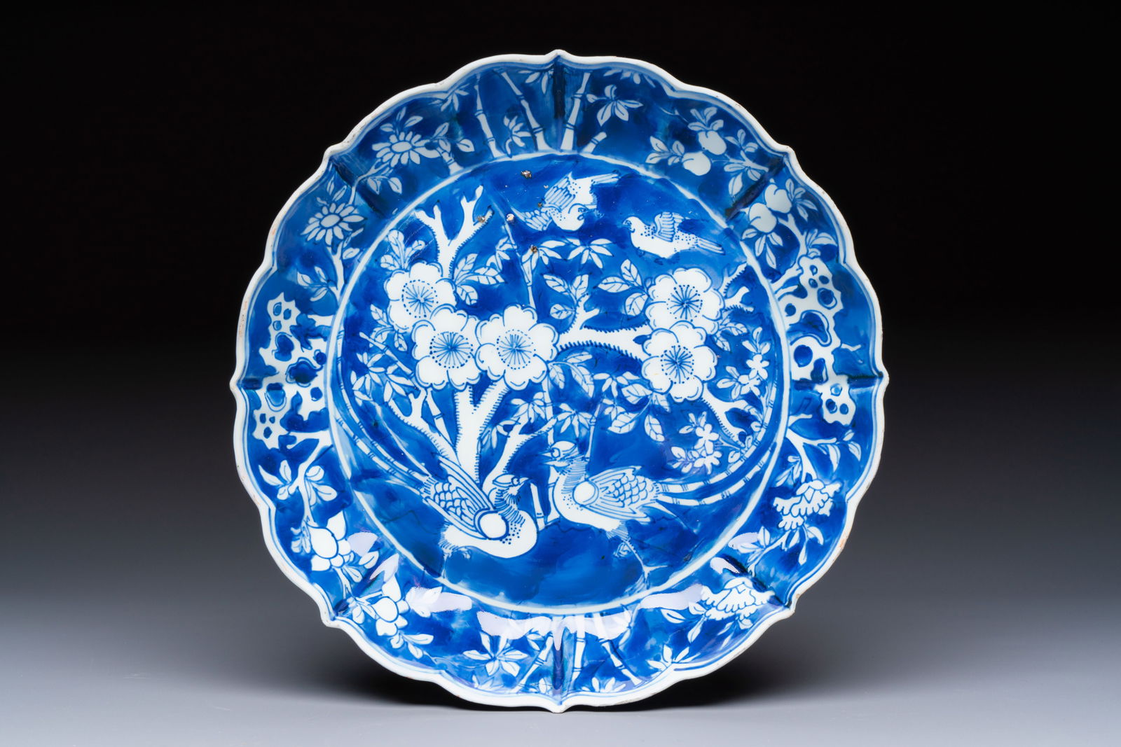 A Chinese blue and white Ko-Sometsuke 'Birds among Flowering Branches' plate for the Japanese (1 of 2)