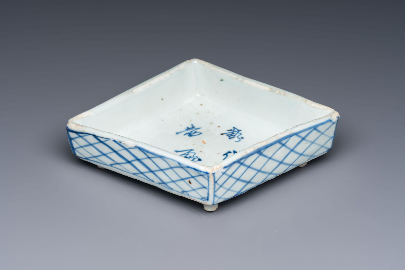 A rare Chinese blue and white Ko-Sometsuke lozenge-shaped inscribed tray for the Japanese market,: A rare Chinese blue and white Ko-Sometsuke lozenge-shaped inscribed tray for the Japanese market, Tianqi Dim.: 16,7 x 12,7 x 3,8 cm Provenance: - The Geoffrey Middle Collection, UK.