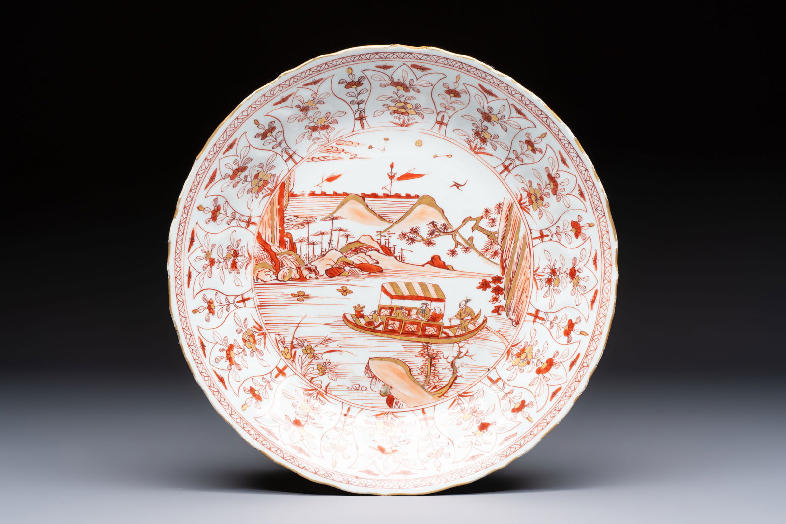 A Chinese iron-red and gilt-decorated 'Ode to the Red Cliff' dish, Kangxi (1 of 2)