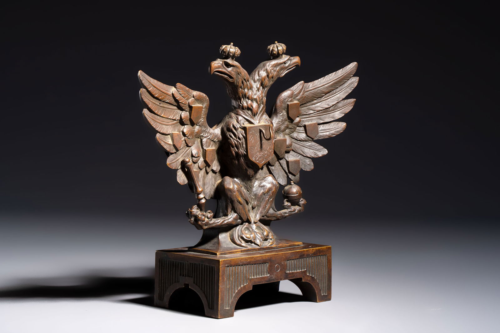 A bronze imperial Russian double-headed eagle coat of arms, mounted as a pocket watch holder, (1 of 7)