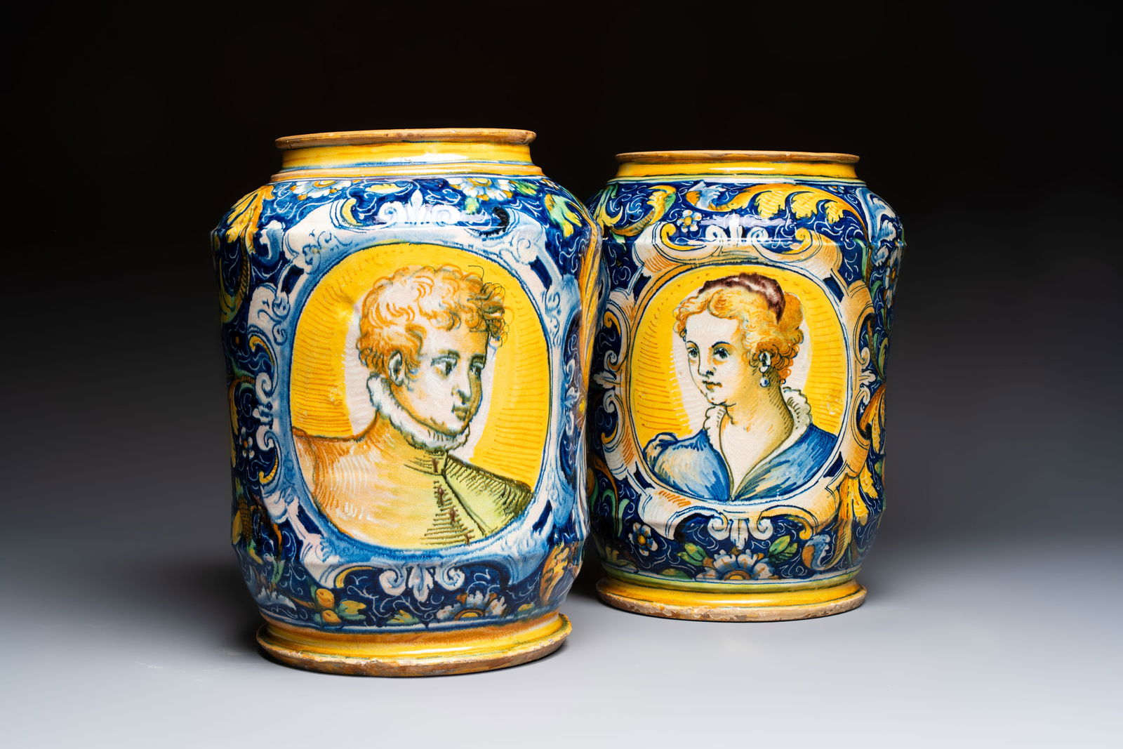 An exceptional pair of large polychrome Italian maiolica albarelli with a bust of a man and a woman,: An exceptional pair of large polychrome Italian maiolica albarelli with a bust of a man and a woman, Venice, workshop of Maestro Domenico, mid 16th C. H.: 37,3 cm (the tallest)